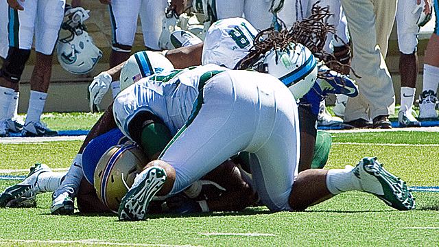 Devon Walker (No. 18) of Tulane was administered CPR on the field after this collision. (AP)