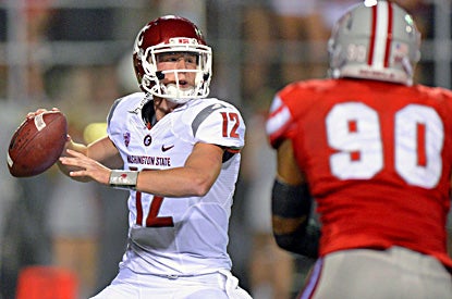 Connor Halliday, starting in place of injured Jeff Tuel, throws four first-half touchdown passes for the Cougars. (US Presswire)