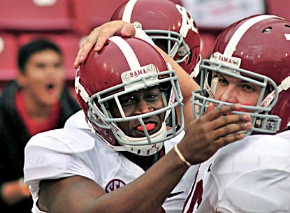 Alabama's Blake Sims (left) celebrates with Ryan Kelly after Sims' fourth-quarter touchdown. (AP)