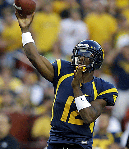 In a blowout over James Madison, Geno Smith breaks Marc Bulger's WVU record for career passing yards with 8,153.  (AP)