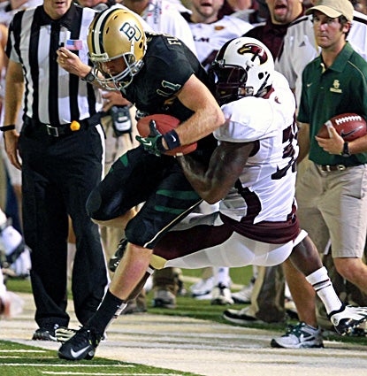 Baylor QB Nick Florence completes 26 of 39 passes for 351 yards and a career-best four touchdowns.  (AP)