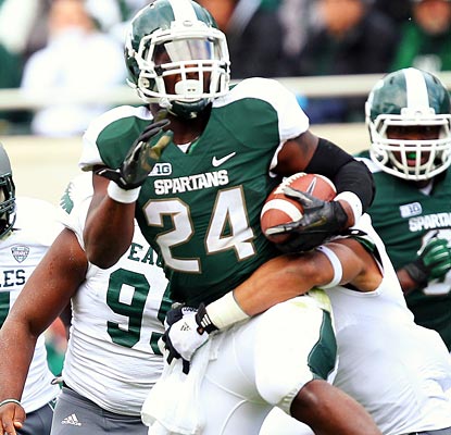 Michigan State puts its offense on Le'Veon Bell's shoulders, and he responds with a career-high 253 rushing yards.  (US Presswire)