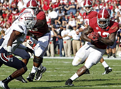 Alabama running back Eddie Lacy runs for a first down against Florida Atlantic. Lacy rushes for 106 yards in the first half. (AP)