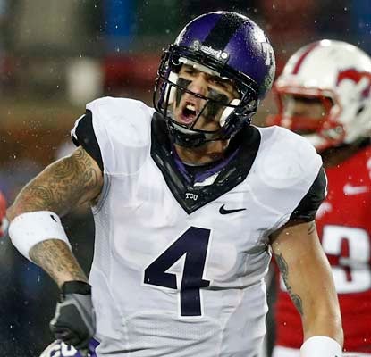 TCU's Casey Pachall fights through a heavy rainstorm to toss two touchdowns for the Horned Frogs.  (US Presswire)