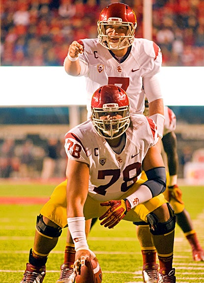USC's Matt Barkley passes for 303 yards and three touchdowns to lead the Trojans past Utah. (US Presswire)