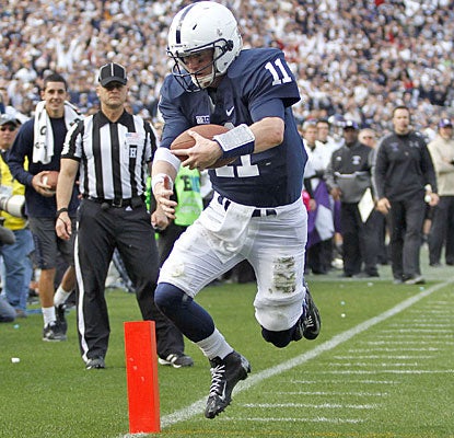 Matt McGloin runs for the go-ahead score after using his arm (school-record 35 completions) to keep PSU in the game.  (Getty Images)