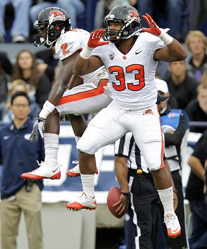 Wide receiver Markus Wheaton (2) celebrates one of his three touchdowns against BYU. (AP)