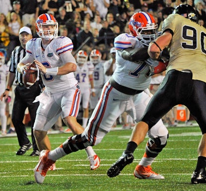 Jeff Driskel runs for 177 yards and three touchdowns in the Gators' 31-17 win over the Commodores. (Getty Images)