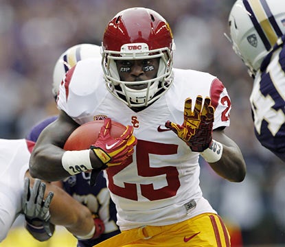 Silas Redd rumbles for 155 yards -- 108 in the first half -- and a score to help USC improve to 5-1. (AP)
