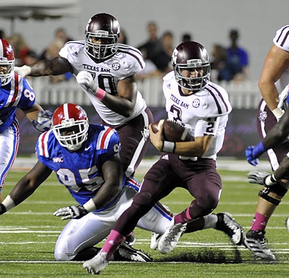 Aggies QB Johnny Manziel scores six touchdowns and finishes with 577 total yards (396 in the air, 181 on the ground). (AP)