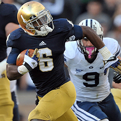 Theo Riddick rushes for a career-best 143 yards, including runs of 55 and 27 yards, to lead No.5 Notre Dame past BYU. (US Presswire)