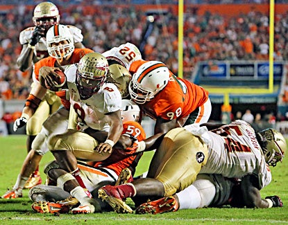 Devonta Freeman scores one of two fourth-quarter touchdowns against Miami. (US Presswire)