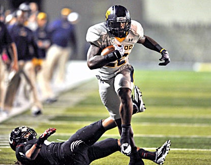 David Fluellen runs for a first down in the fourth quarter as Toledo knocks off previously unbeaten Cincinnati. (AP)