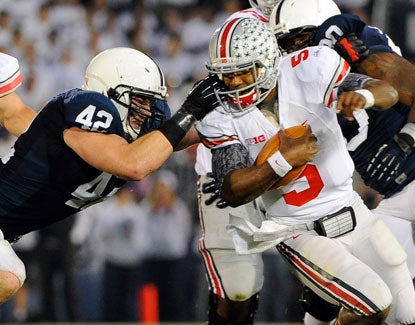 Quarterback Braxton Miller reaches 100 yards rushing for the sixth time this season, carrying 25 times. (US Presswire)