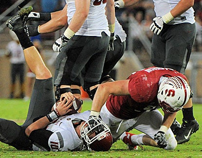 Stanford sacks Jeff Tuel 10 times, including this takedown by Cardinal DE Henry Anderson. (US Presswire)