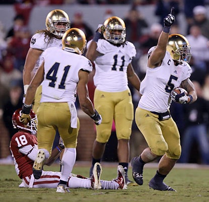 Manti Te'o celebrates an interception late in the fourth to help Notre Dame seal its best start in a decade. (US Presswire)