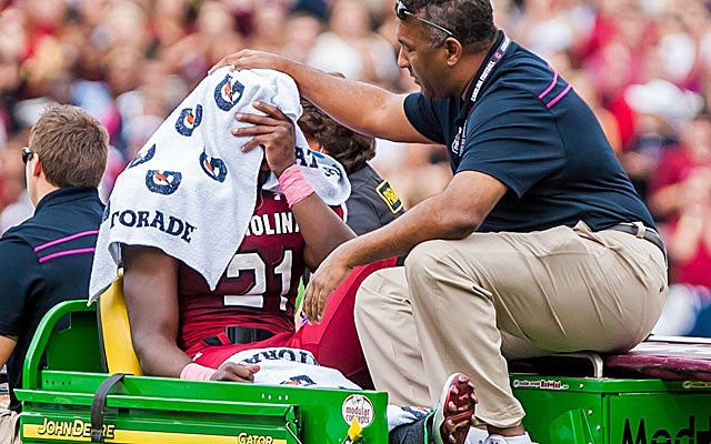 "We're optimistic his football days are ahead of him," Spurrier says of Lattimore. (US Presswire)