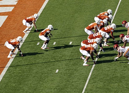 Texas runs its first play out of the wishbone, one of former coach Darrell Royal's innovations.  (AP)