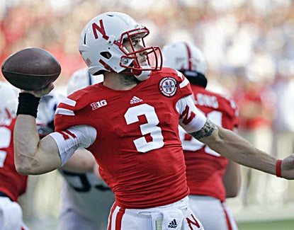 Taylor Martinez finishes with 171 yards through the air and also runs for 104 in the Cornhuskers' win. (AP)