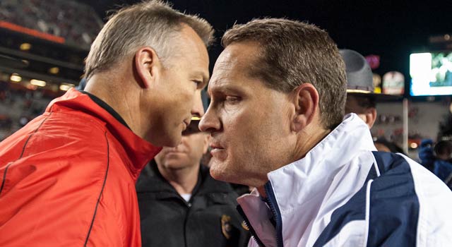 Georgia's Mark Richt (left) is heading to Atlanta while Gene Chizik might soon be unemployed. (Getty Images)