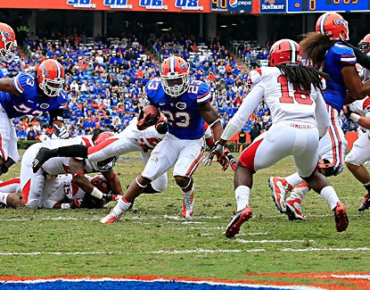 Florida's Mike Gillislee scores the Gators' first points of the game on a seven-yard run in the first quarter. (Getty Images)