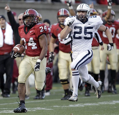 Harvard running back Treavor Scales sprints down the sideline for a game-clinching 63-yard touchdown.  (AP)
