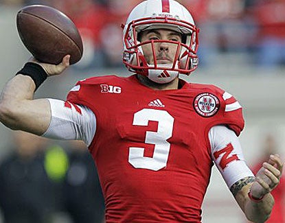 Nebraska's Taylor Martinez throws for 308 yards and two scores, becoming the Huskers' all-time passing leader. (AP)