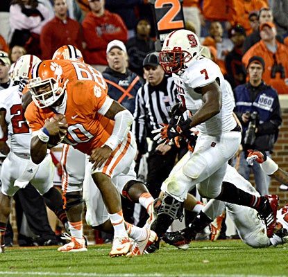 Tajh Boyd, who tosses five touchdown passes, runs in for one of his three rushing scores against N.C. State. (AP)