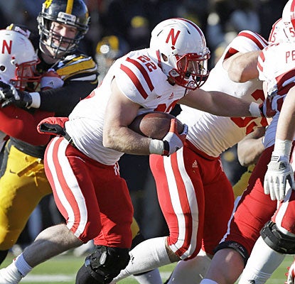 After missing four games, Rex Burkhead steps in to gain 69 yards and score Nebraska's only touchdown.  (AP)