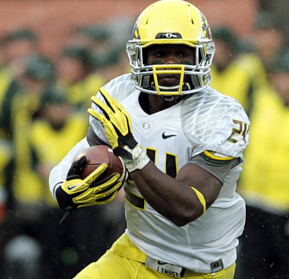 Kenjon Barner rushes for 198 yards and two touchdowns as Oregon turns a close game into a typical Ducks blowout.  (AP)