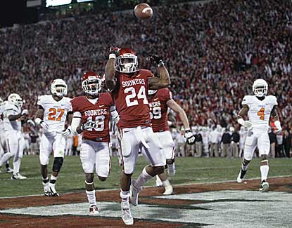 Oklahoma running back Brennan Clay tosses the football after scoring the game-winning touchdown. (US Presswire)
