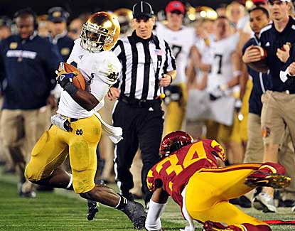 Notre Dame RB Theo Riddick rumbles for 146 yards and a touchdown for the title game-bound Irish. (US Presswire)