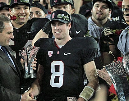 Stanford QB Kevin Hogan receives the MVP trophy after the Pac-12 title game. He throws for 155 yards and a touchdown. (US Presswire)