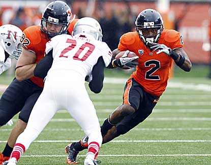 Oregon State wide receiver Markus Wheaton dodges Nicholls State defender Dwight Storay on Saturday. (AP)