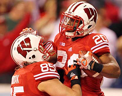 Wisconsin's James White and Brian Wozniak celebrate White's touchdown in the Big Ten title game. (US Presswire)