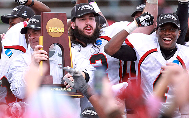 Valdosta State coach David Dean (with trophy) and the Blazers celebrate their national title. (US Presswire)