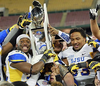 San Jose State players hoist a trophy as they rejoice their Military Bowl victory over Bowling Green. (US Presswire)