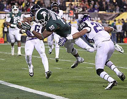 Michigan State wide receiver Aaron Burbridge dives over the goal line for a 16-yard touchdown. (AP)