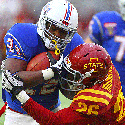 Trey Watts powers his way for 149 yards to carry Tulsa past Iowa State in the Liberty Bowl. (US Presswire)