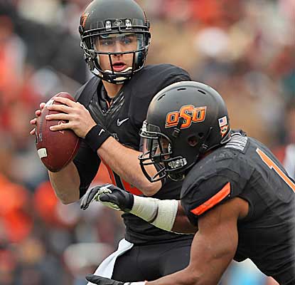 Clint Chelf's three TD passes help lead the Cowboys to their biggest bowl win since 1988. (Getty Images)