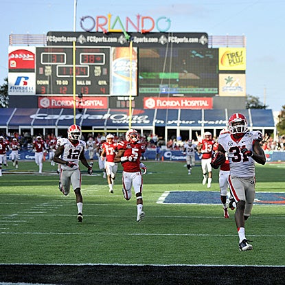 Georgia's Chris Conley (right) (two catches for 136 yards) scores one of his two touchdowns. (US Presswire)