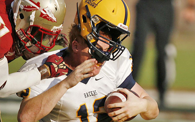 Under a proposed rule, in addition to a 15-yard penalty, players can be ejected for targeting the head. (Getty Images)
