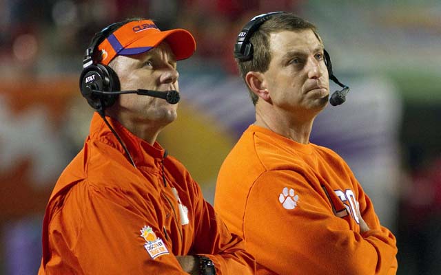 Clemson OC Chad Morris (left) is one of many names being thrown around for Louisville. (USATSI)