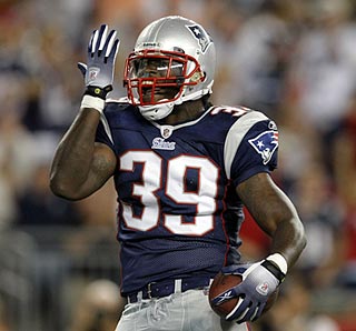 New England's Laurence Maroney celebrates his 5-yard touchdown run in the second quarter.  (US Presswire)