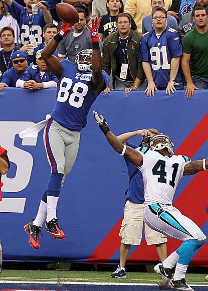 Hakeem Nicks leaps to make his second TD catch as the Panthers' Captain Munnerlyn watches.  (Getty Images)