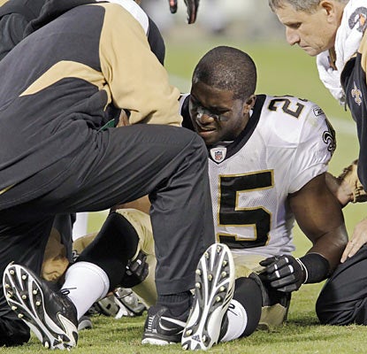 While the Saints pull out a big win, they suffer a potentially huge loss when Reggie Bush injures his leg on a muffed punt.  (AP)