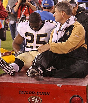 Reggie Bush's leg injury will force the Saints to change their game plans. (Getty Images)