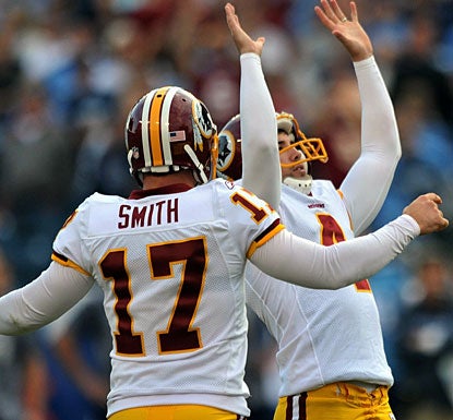 Redskins kicker Graham Gano raises his hands in victory after nailing a 48-yard, game-winning field goal in overtime.  (US Presswire)