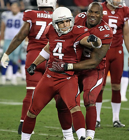 Arizona's Jay Feely and Beanie Wells celebrate Feely's game-winning 48-yard field goal to beat Dallas.  (Getty Images)