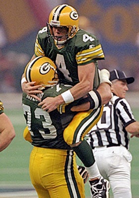 Favre celebrates during his Super Bowl victory over the Patriots in 1997. (Getty Images)